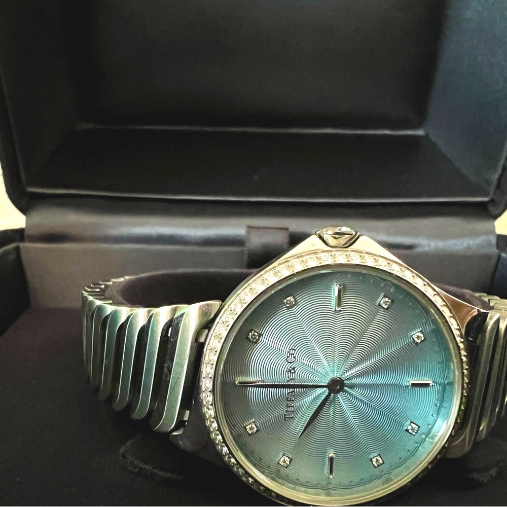 Tiffany Metro 2-Hand 28mm Watch with Diamond Bezel and a diamond on the Crown.